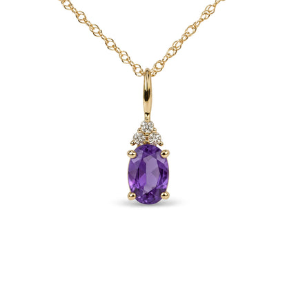 Yellow metal necklace with an oval-shaped purple gemstone pendant accented by three round white gemstones in a prong setting, shown in a close-up front view.