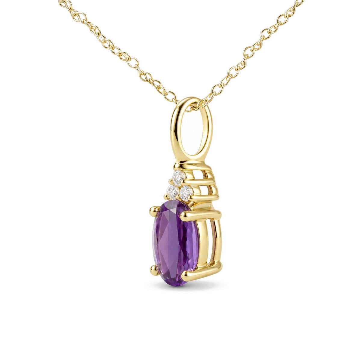 Close-up front angle of a yellow metal necklace with a pendant featuring a pear-shaped purple gemstone held by prongs, accented with three round white gemstones in prong settings above it.