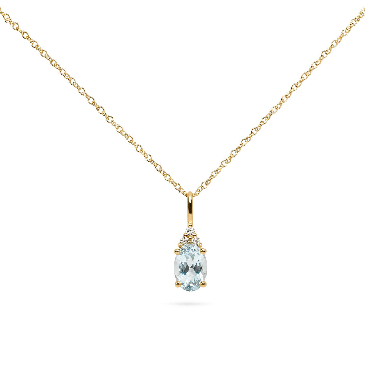 Close-up front view of a yellow metal necklace with a pendant featuring an oval blue gemstone surrounded by three round white gemstones in prong settings.