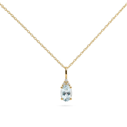 Close-up front view of a yellow metal necklace with a pendant featuring an oval blue gemstone surrounded by three round white gemstones in prong settings.