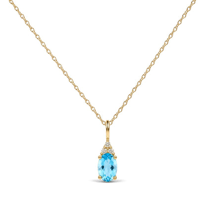 Close-up front view of a yellow necklace featuring an oval blue gemstone pendant accented with three round white gemstones above it.