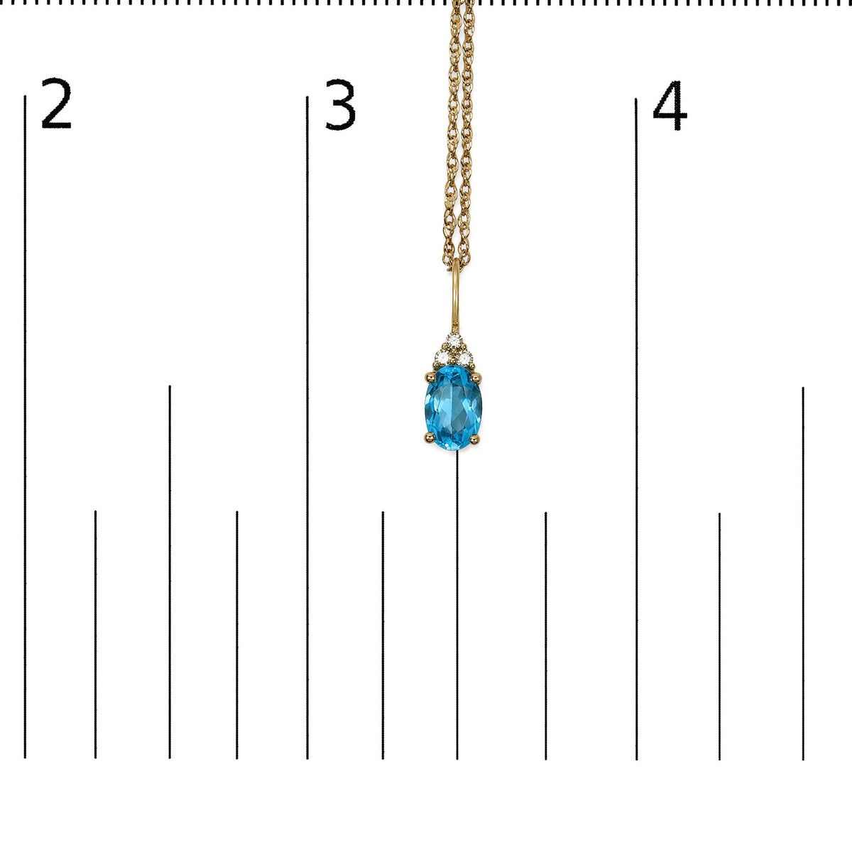 Yellow necklace with a pendant featuring an oval blue gemstone surrounded by three round white gemstones in prong settings, shown on a scale, close-up front view.