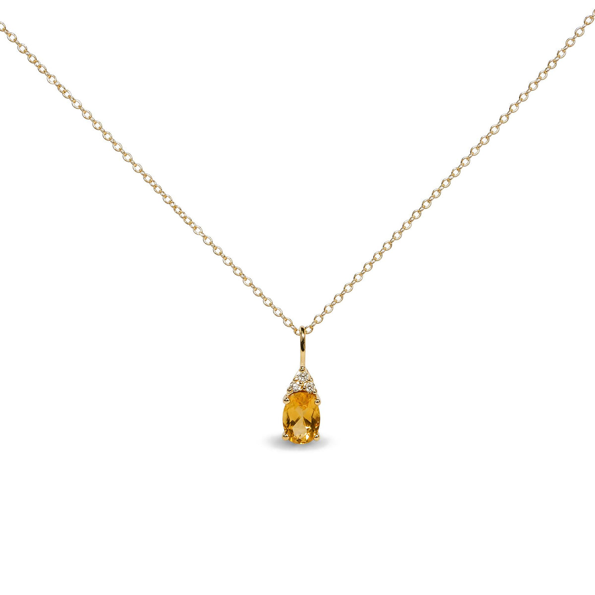 Close-up front view of a yellow metal necklace with an oval yellow gemstone pendant accented by three round white gemstones in prong settings.