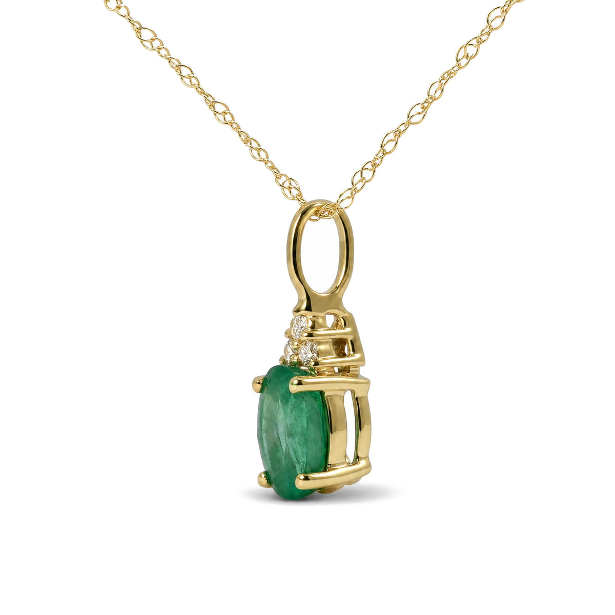 Yellow metal necklace with an oval green gemstone pendant accented by three round white gemstones in a prong setting, shown in a close-up angle.