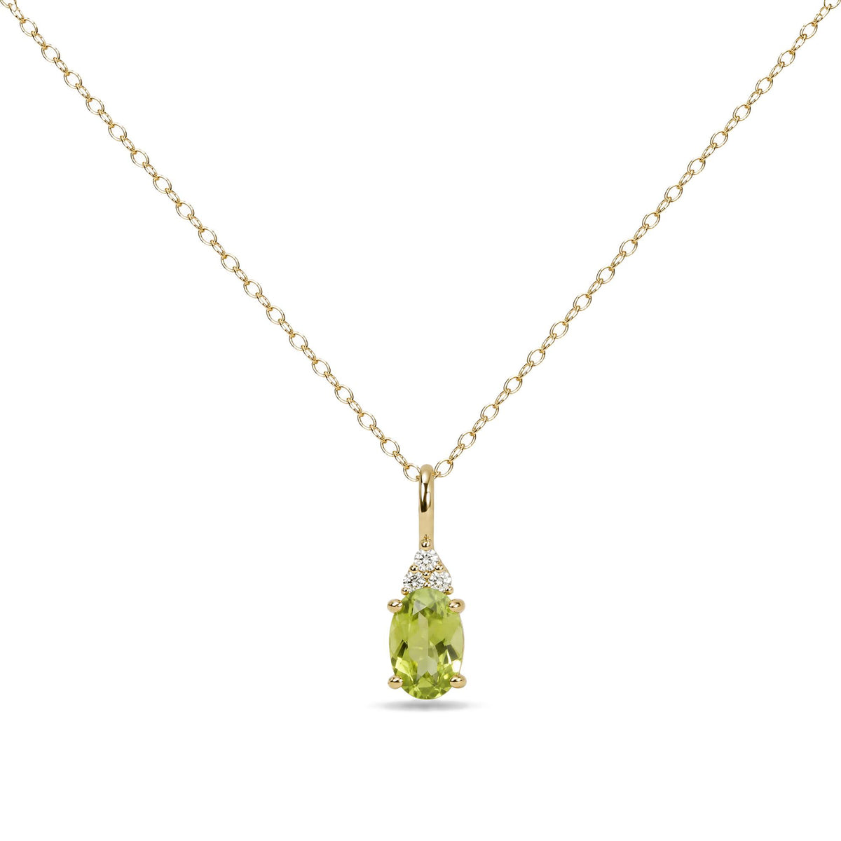 Yellow metal necklace with an oval green gemstone pendant accented by three round white gemstones in a prong setting, shown in a close-up front view on a white background.