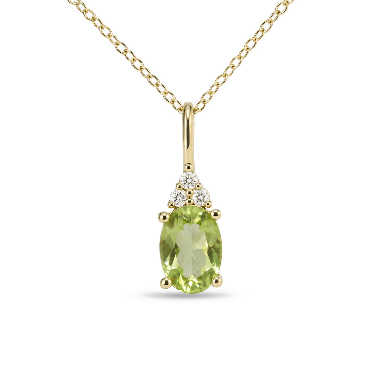Close-up front view of a yellow metal necklace with an oval green gemstone pendant accented by three round white gemstones above it, shown on a white background.