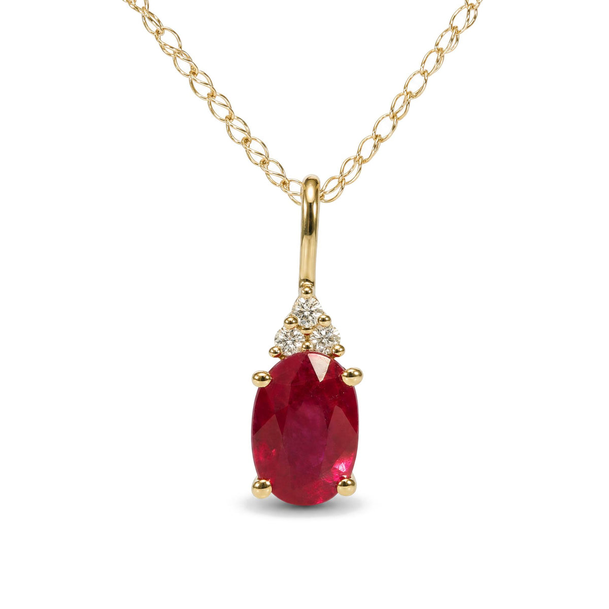 Close-up front view of a yellow metal necklace with oval-shaped red gemstone pendant accented by round white gemstones in prong settings.