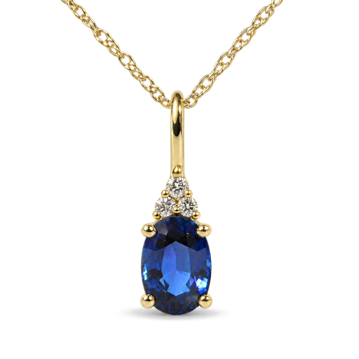 Close-up front view of a yellow metal necklace pendant featuring an oval blue gemstone set below three round white gemstones in prong settings, hanging from a twisted linked chain.