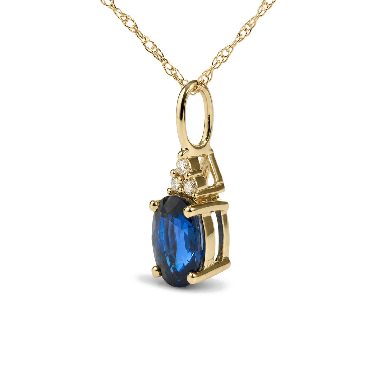 Close-up front angle of a yellow necklace pendant featuring one oval-shaped blue gemstone prong set with three round white gemstones above, also prong set.