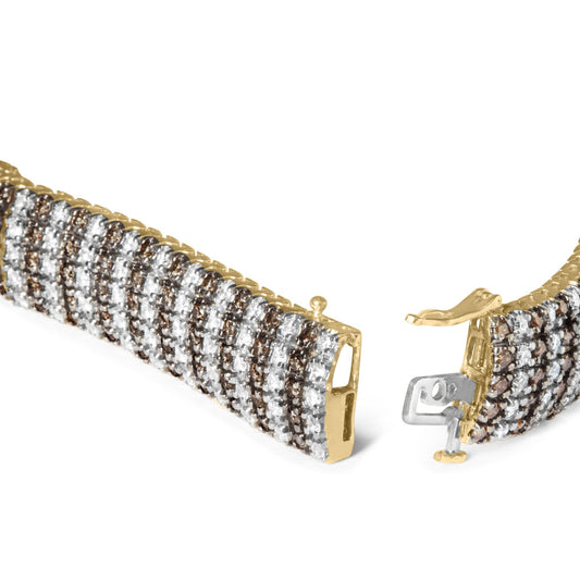 Close-up front angle of yellow bracelet with alternating rows of round white and brown gemstones set in prongs, showing open clasp.