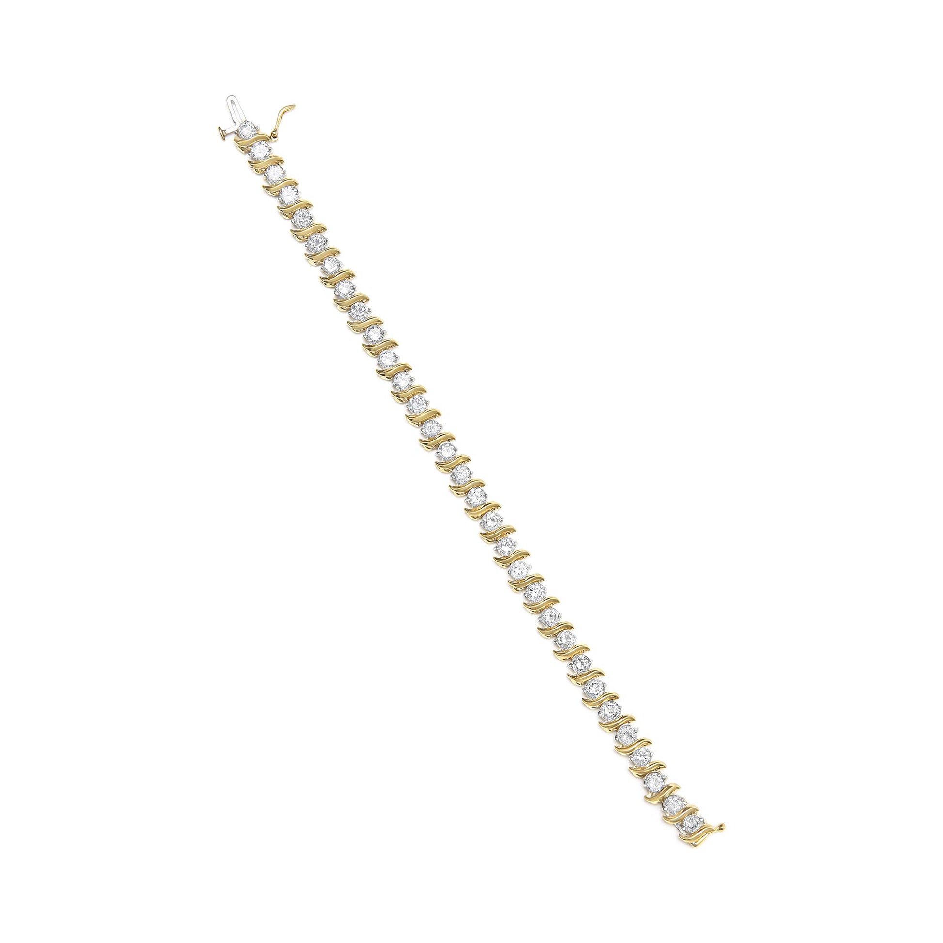 Yellow metal bracelet with round white gemstones in prong settings, shown from a top flat lay angle.