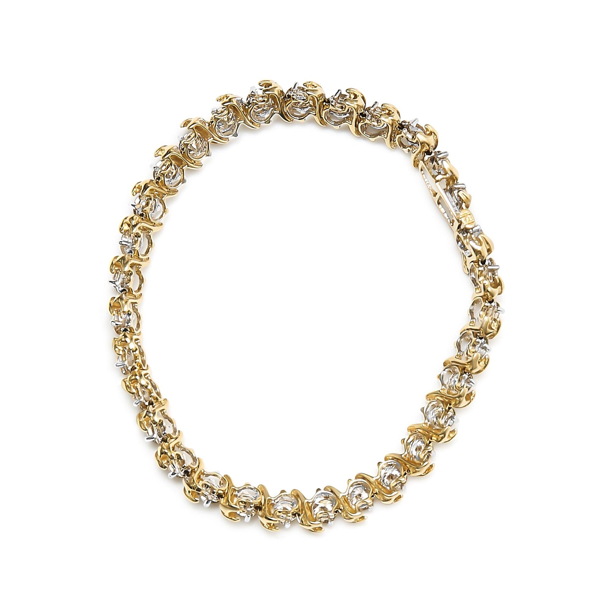 Top-down view of a yellow metal bracelet featuring round white gemstones in prong settings arranged in a continuous loop.