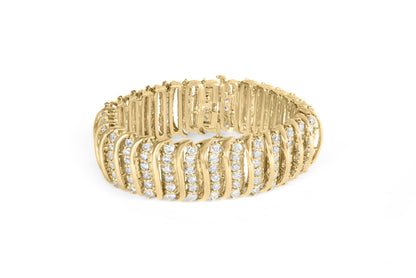 Yellow metal bracelet with rows of round white gemstones in prong settings, shown in a front angled view on a white background.