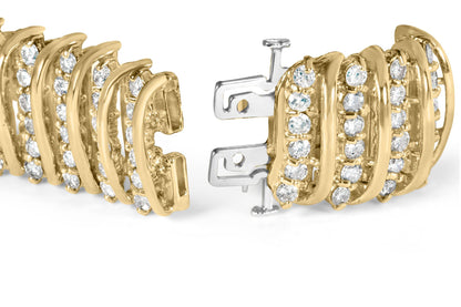 Close-up angled view of a yellow metal bracelet with rows of round white gemstones in prong settings and a visible clasp mechanism.