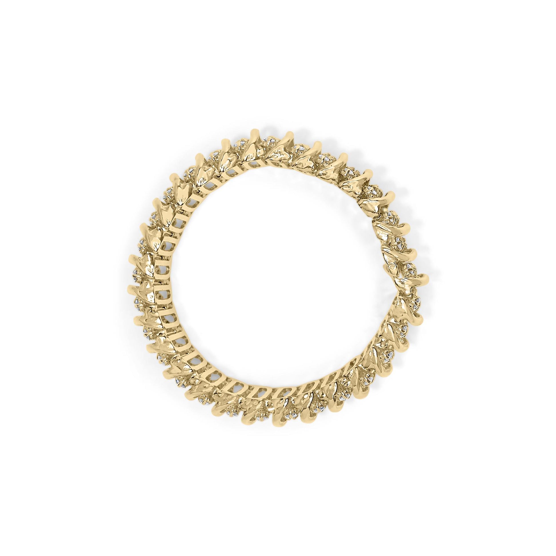 Top-down view of a yellow metal bracelet with round white gemstones in prong settings encircling the entire band.
