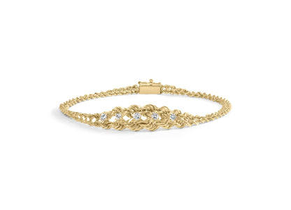 Yellow metal bracelet with a woven pattern and five round white gemstones in prong settings, shown from a front-facing angle on a white background.