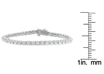 White metal bracelet with round white gemstones in prong settings, displayed flat next to a ruler for size reference, shown from a side angle.