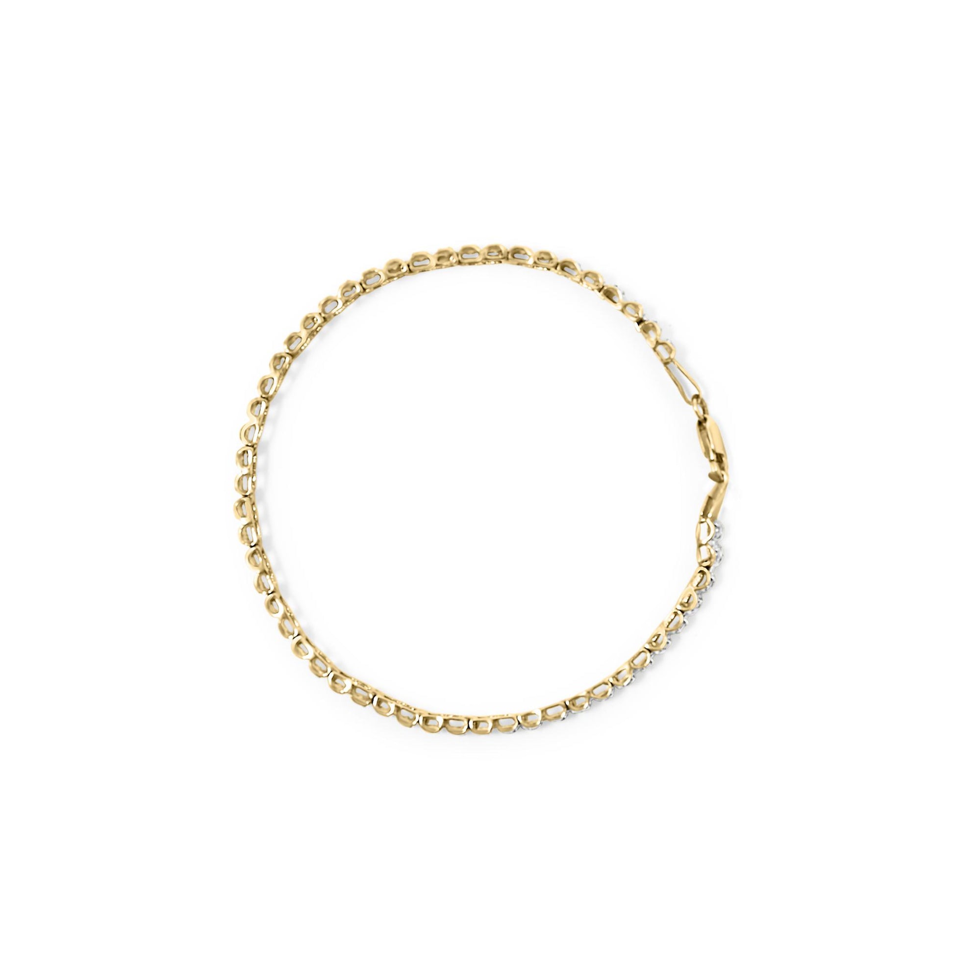 Top-down view of a yellow bracelet with round white gemstones in prong settings along part of its length on a white background.
