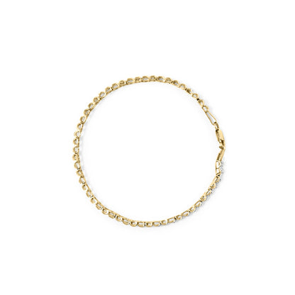 Top-down view of a yellow bracelet with round white gemstones in prong settings along part of its length on a white background.