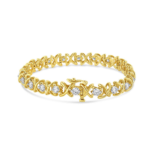 Yellow metal bracelet with round white gemstones in prong settings, shown in a front angled view.