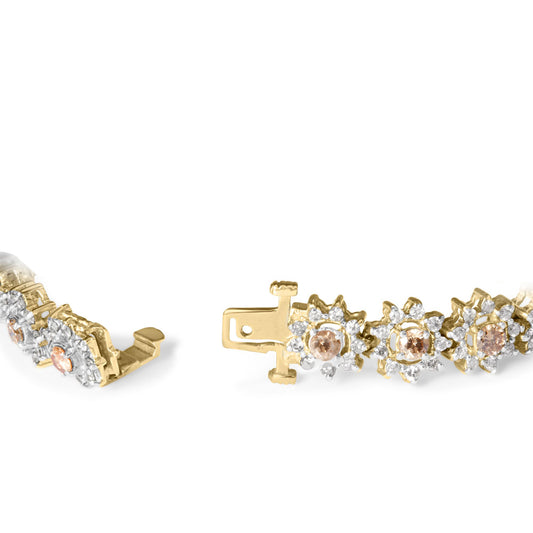 Close-up angled view of a yellow metal bracelet featuring round champagne and white gemstones in prong settings arranged in floral clusters with a clasp open.