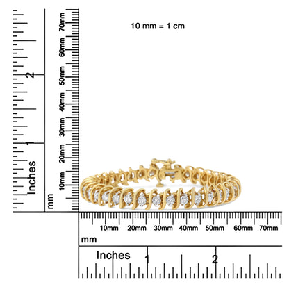 Yellow metal bracelet with round white gemstones in two-prong settings, shown at a front angle on a ruler for size reference.