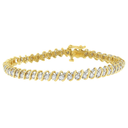 Yellow metal bracelet with a row of round white gemstones in prong settings, shown from a slight side angle.