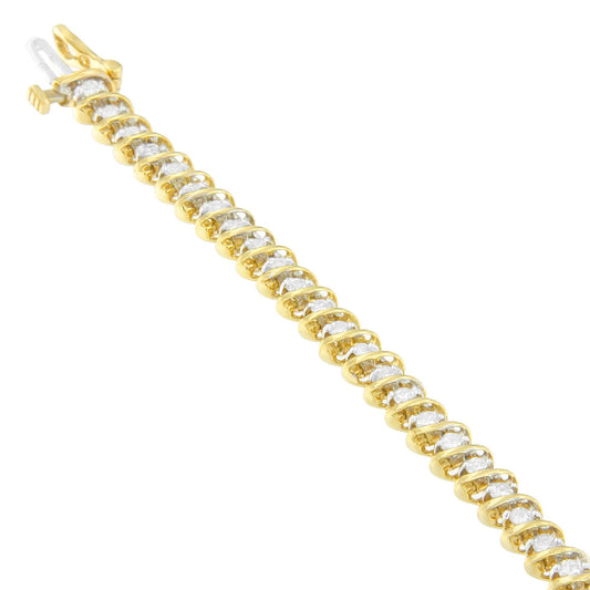 Yellow metal bracelet with prong-set round white gemstones, shown in a diagonal close-up angle.