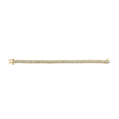 Yellow metal bracelet with round white gemstones in 2-prong settings, shown from a top-down angle.