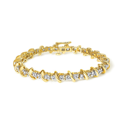 Close-up angle of a yellow metal bracelet with round white gemstones in prong settings, shown laid flat against a white background.