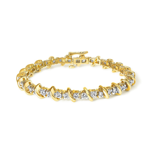Close-up angle of a yellow metal bracelet with round white gemstones in prong settings, shown laid flat against a white background.