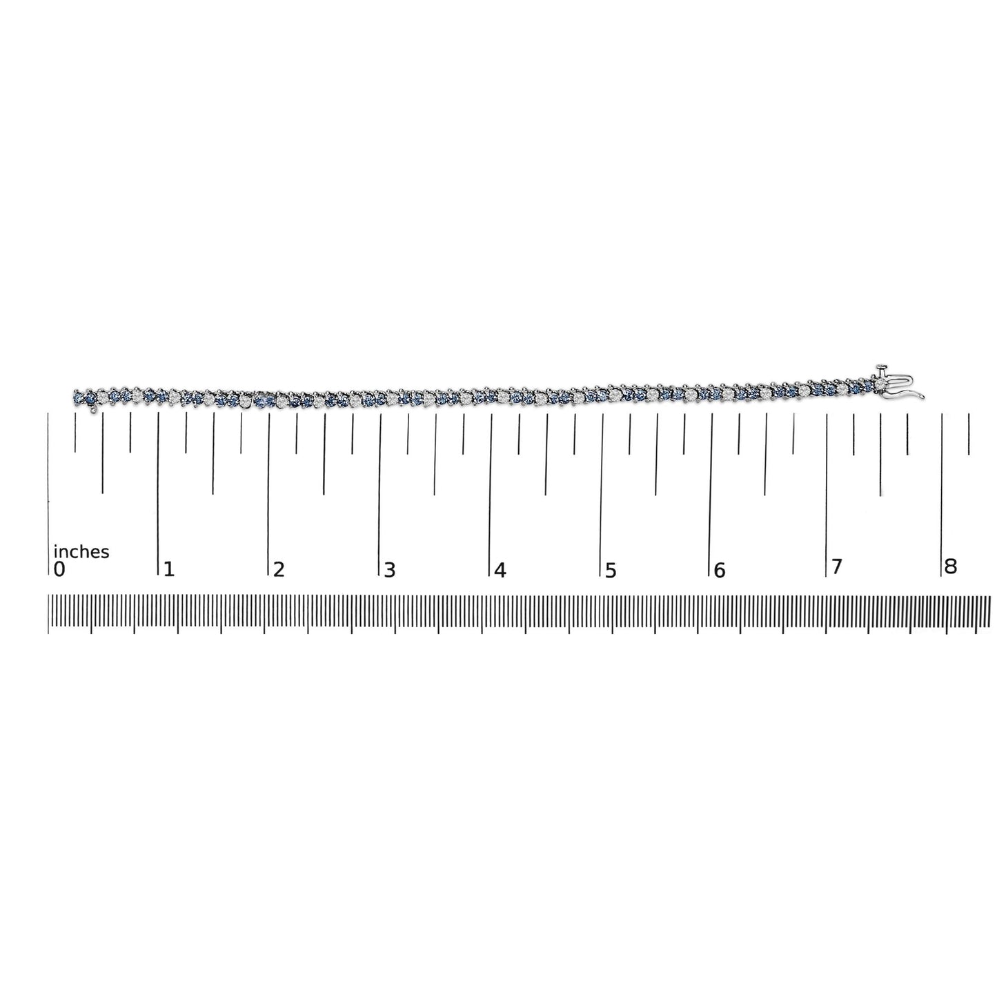 White metal bracelet with alternating white and blue round gemstones in three-prong settings, shown lying flat on a ruler for scale, top-down view.