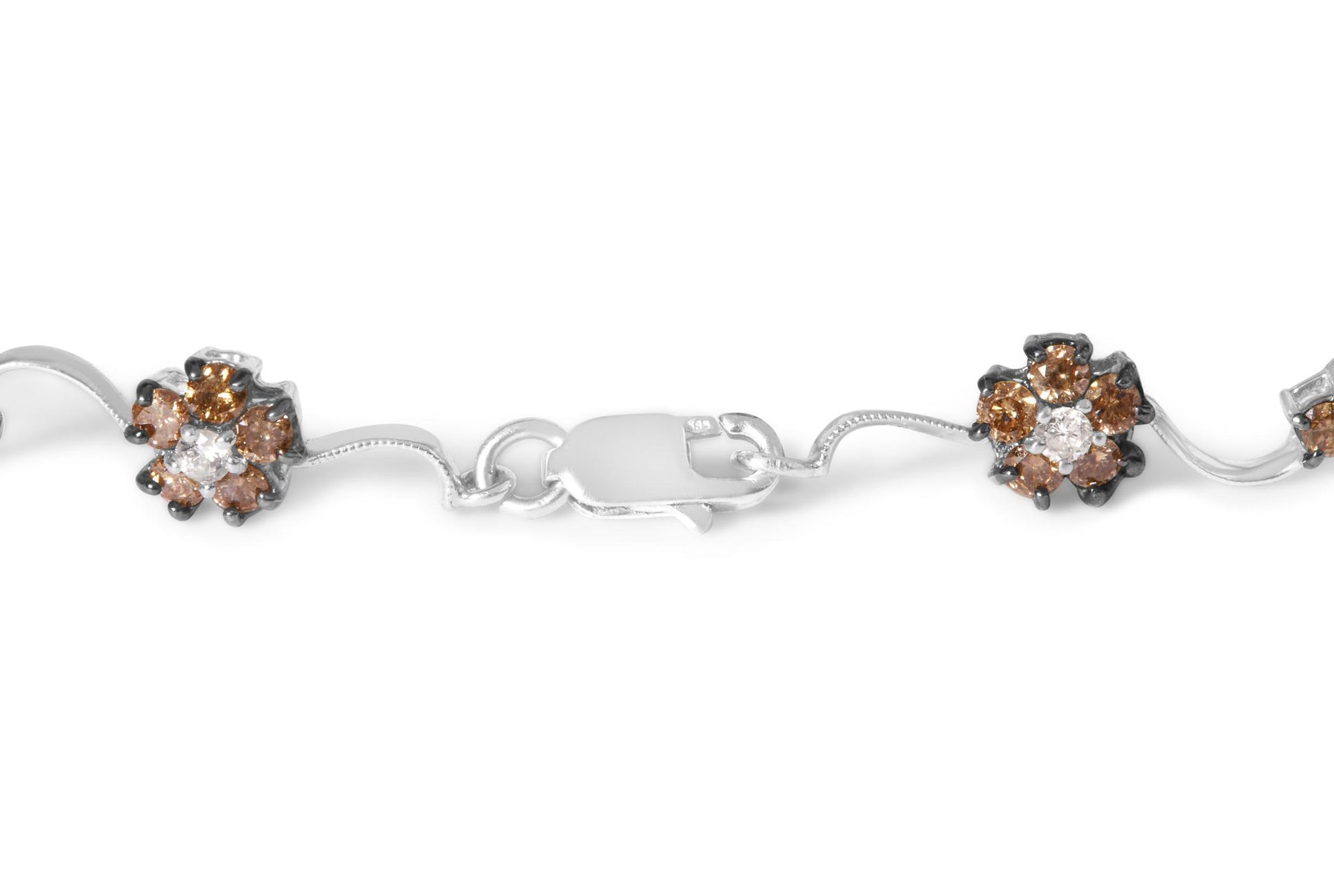 Close-up of a white metal bracelet with floral clusters of round white and champagne-colored gemstones, shown from a top angle.