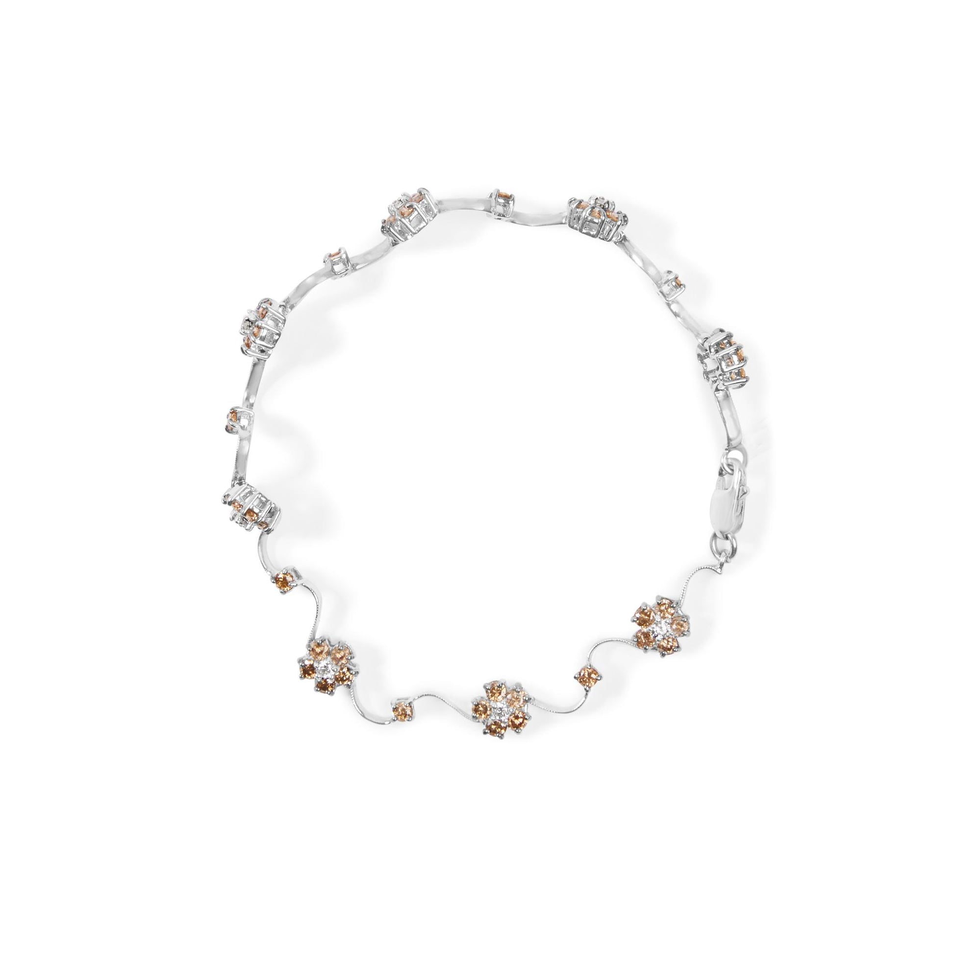 White metal bracelet with round white and champagne gemstones in prong settings, arranged in clusters and linked by thin metal strands, shown from a top-down angle.