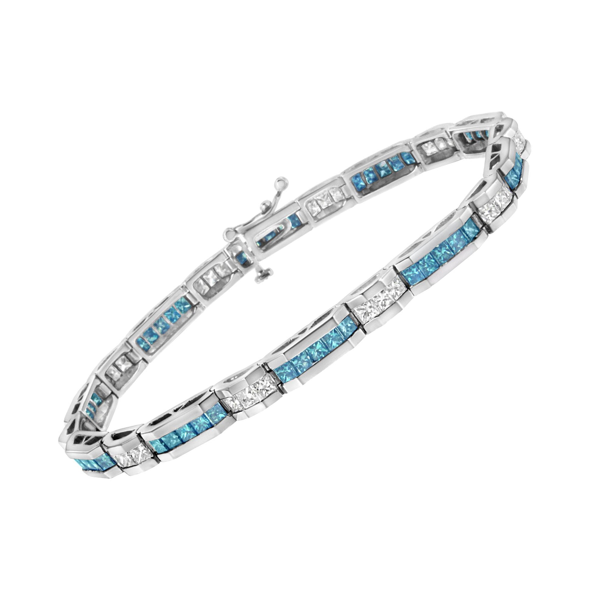 White metal bracelet with alternating white and blue princess-shaped gemstones in channel settings, shown at an angled top view.