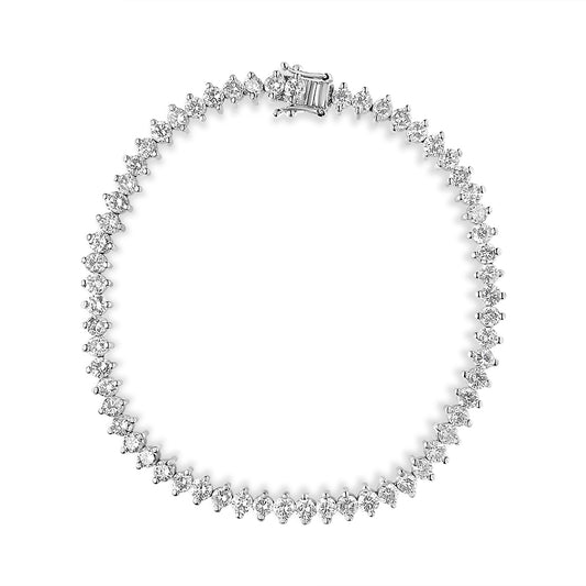 White metal bracelet with round white gemstones in a 2-prong setting, shown from a top-down view.