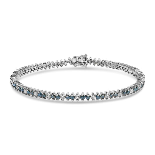White metal tennis bracelet with alternating round white and blue gemstones in prong settings, shown in a front angled view with clasp visible.