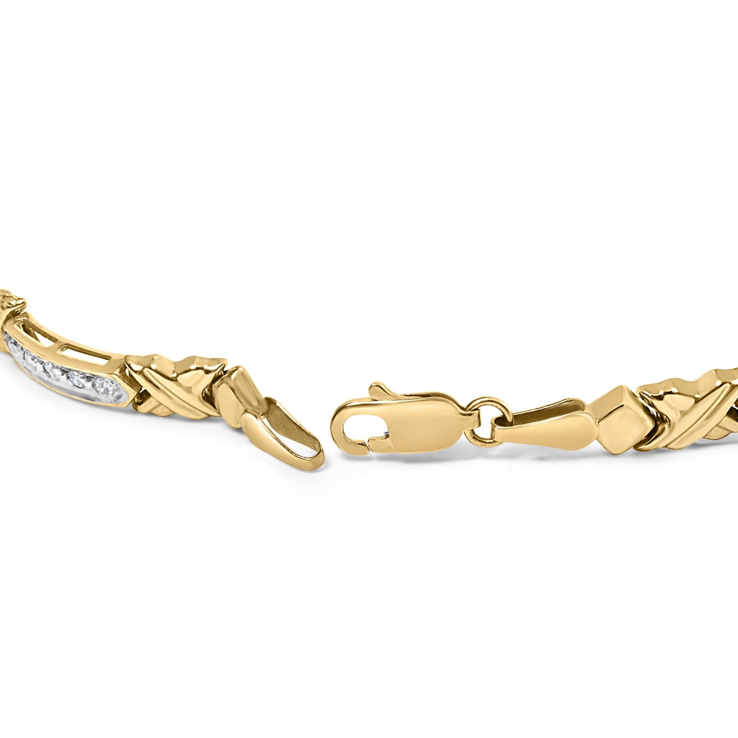 Close-up shot of an open yellow metal bracelet with white round gemstones in prong settings, shown against a white background.
