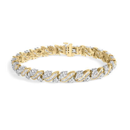 Yellow metal bracelet with alternating round and baguette white gemstones in prong and channel settings, shown at a slight angle.