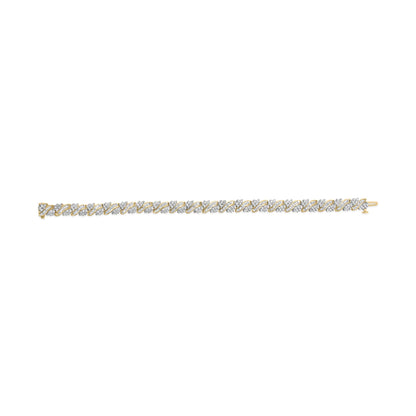 Top-down view of a yellow metal bracelet featuring alternating patterns of round prong-set white gemstones and baguette channel-set white gemstones.