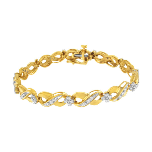 Yellow metal bracelet with alternating twisted links and clusters of white gemstones, shown from a slightly angled top view.