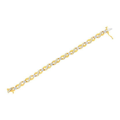 Yellow bracelet with alternating twisted links set with white round gemstones in a pave setting, shown flat on a white background from a slightly angled top view.
