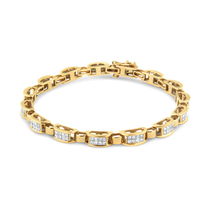 Yellow metal bracelet with sections of white square-shaped gemstones in an invisible setting, shown from a slightly elevated front angle.