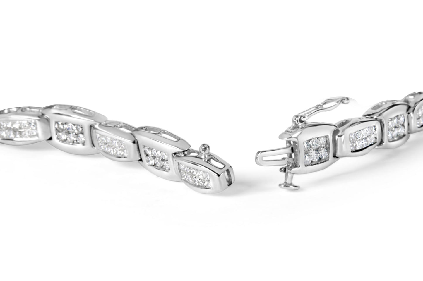 Close-up image of a white metal bracelet with sections featuring round white gemstones in prong settings and princess-shaped white gemstones in invisible settings, shown from a slightly angled top view with the clasp open.