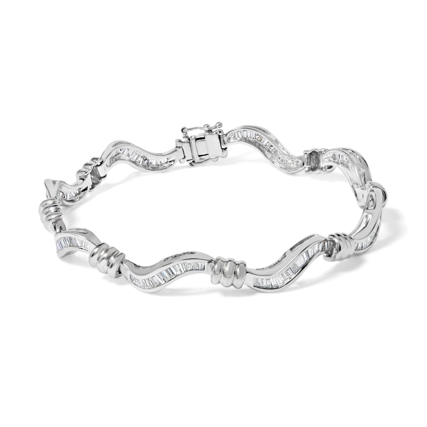 White metal bracelet with a wavy design featuring channel-set baguette-shaped white gemstones, shown from a top angle.