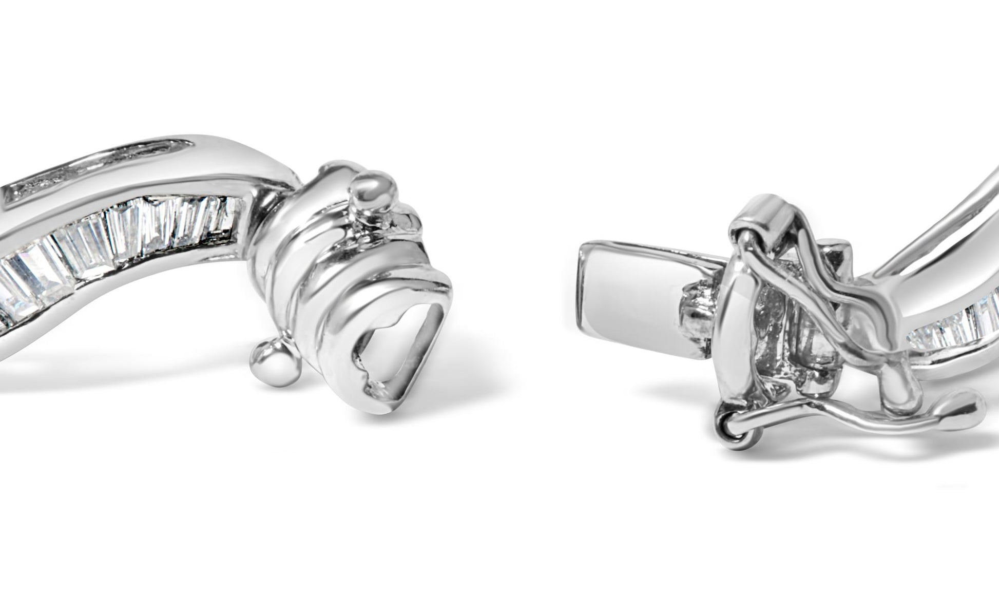 Close-up angled view of a white metal bracelet featuring baguette-shaped white gemstones set in a channel setting, showing the clasp mechanism.