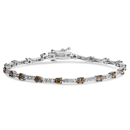 White metal bracelet with alternating white and champagne round gemstones in prong settings, shown in a front angled view.