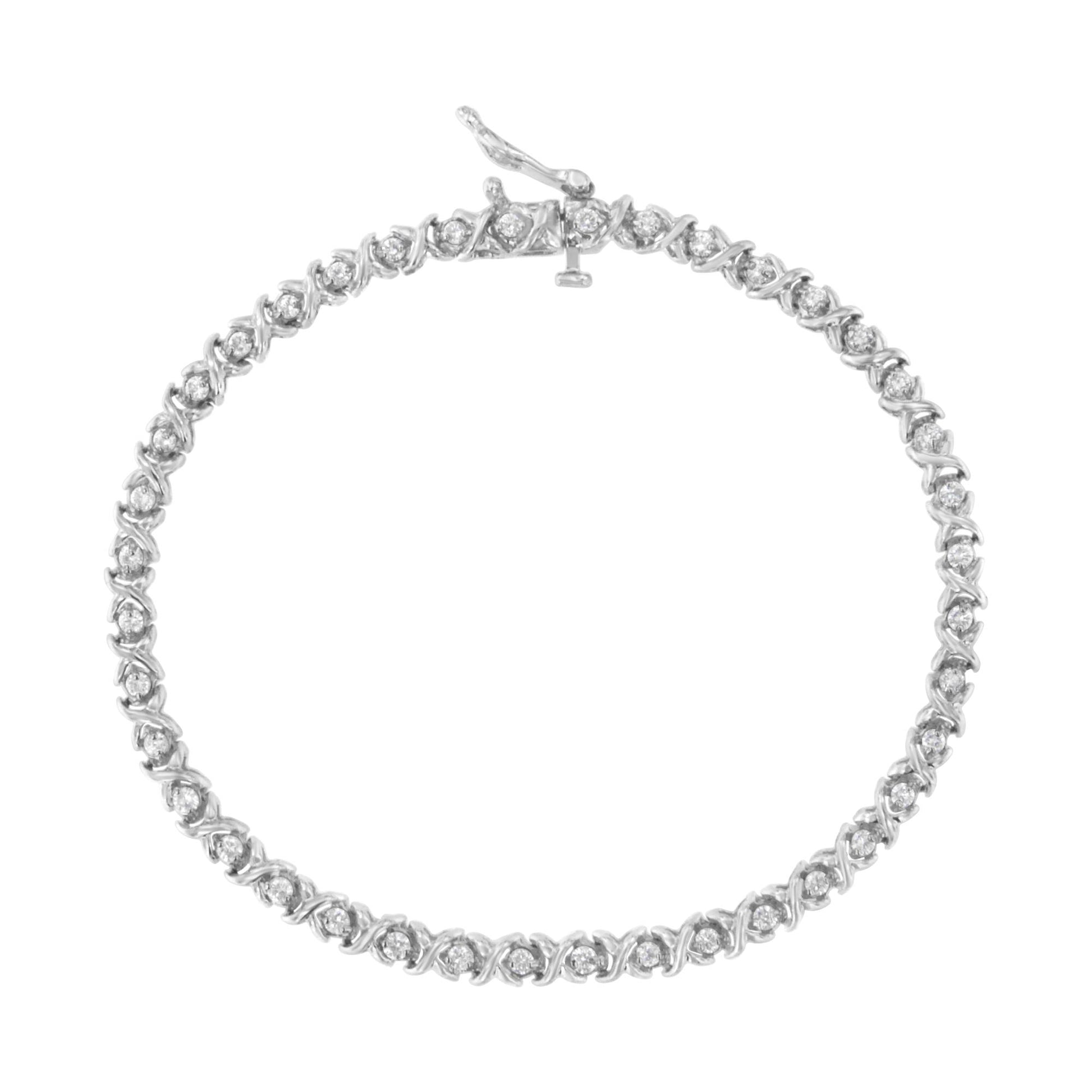 Top-down view of a white metal bracelet with round white gemstones in prong settings forming a continuous loop.