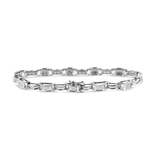 White metal bracelet with links featuring square clusters of white gemstones in invisible setting, shown from a front angle on a white background.