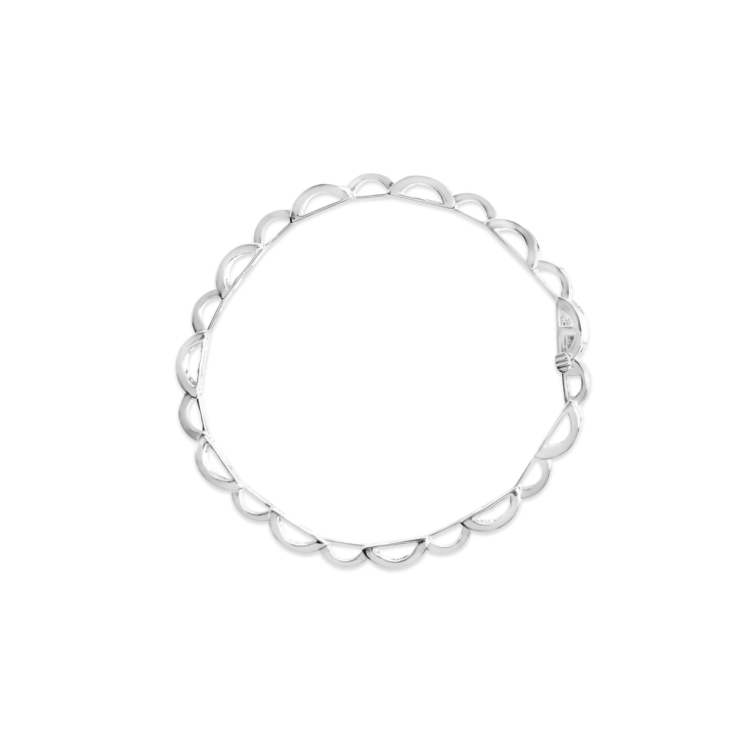 Top-down view of a white metal bracelet with a scalloped edge design featuring princess-shaped white gemstones in an invisible setting.